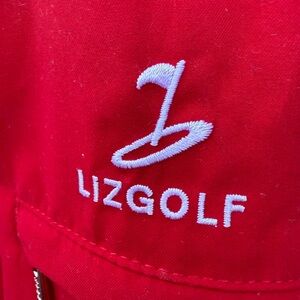 Liz Golf Windbreaker Red w White piping. Womens size L